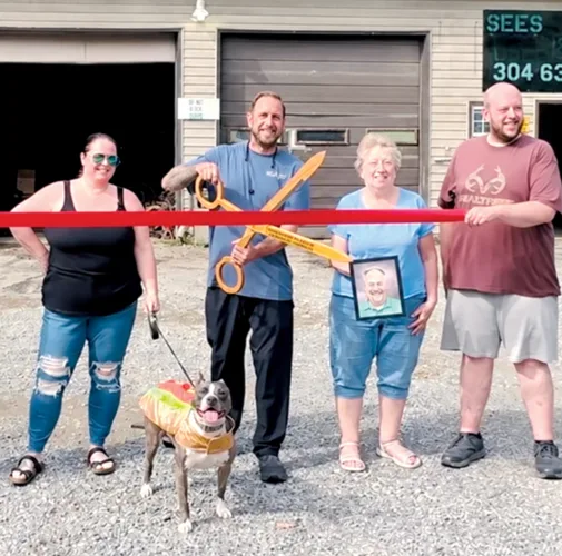 Ribbon-cutting event celebrates new owners of business